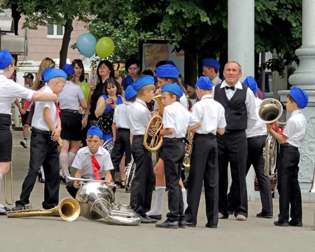 Teacher and his pupils pending for their performance